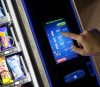 Crane Merchant Media Touch 6 display with cart